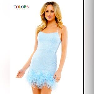 Blue sequin homecoming, semi-formal, or party dress with feather accent.